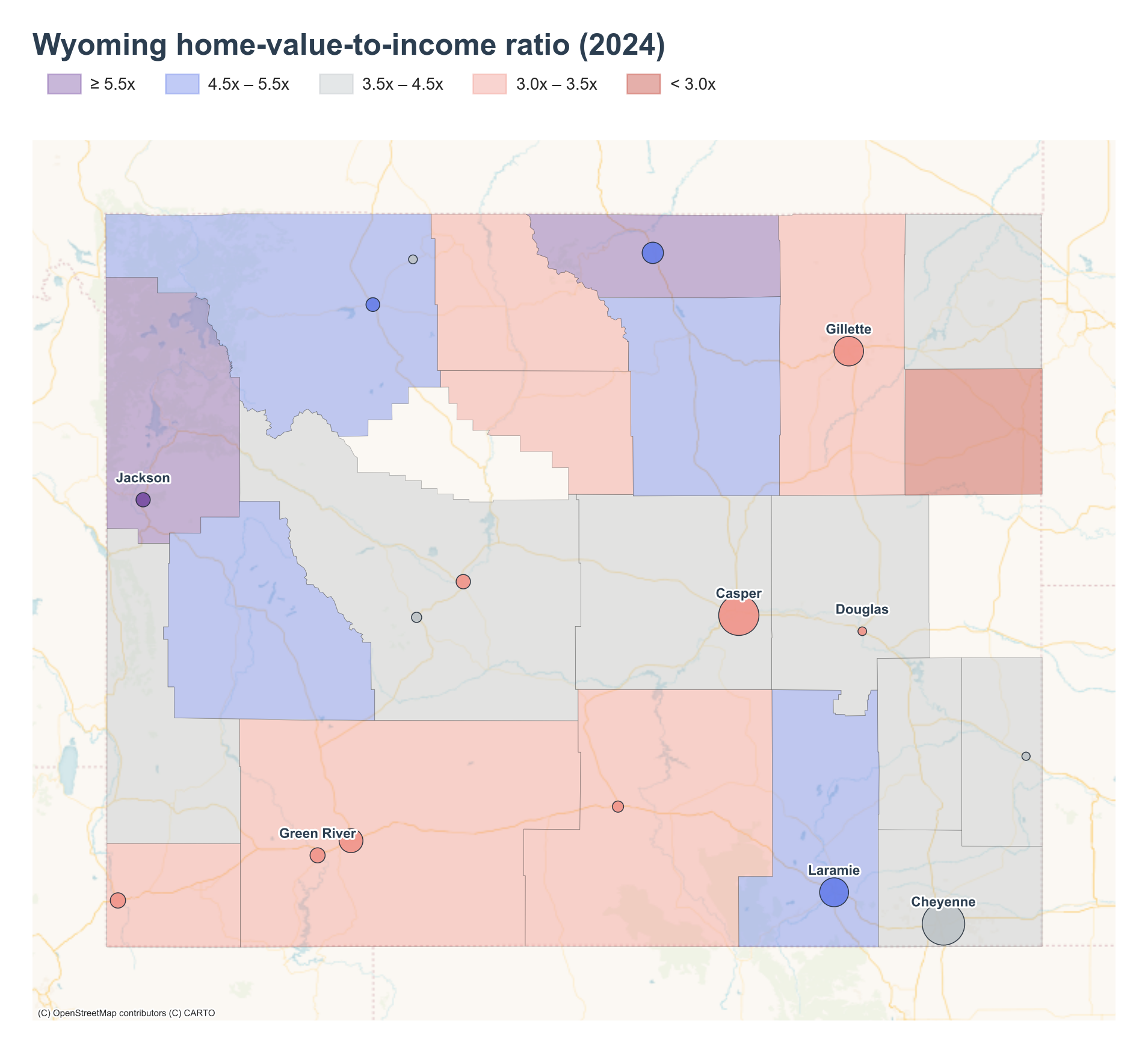Wyoming counties shaded by 2024 home-value-to-income ratio with place markers